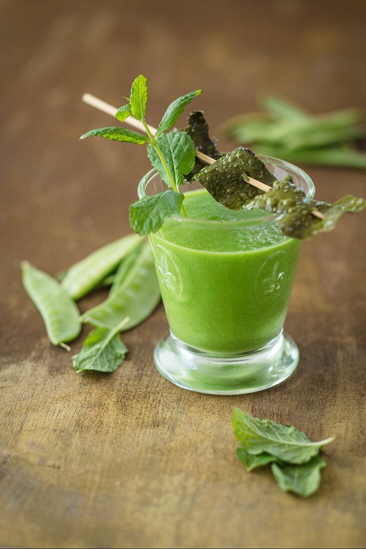 A vegan snow pea shot with algae bacon and mint (detox)