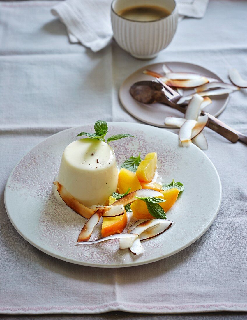 Coconut panna cotta with mint, peach and coconut chips (low carb)