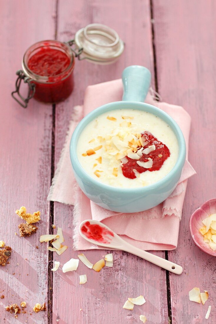 Milk soup with millet flakes and coconut and raspberry jam