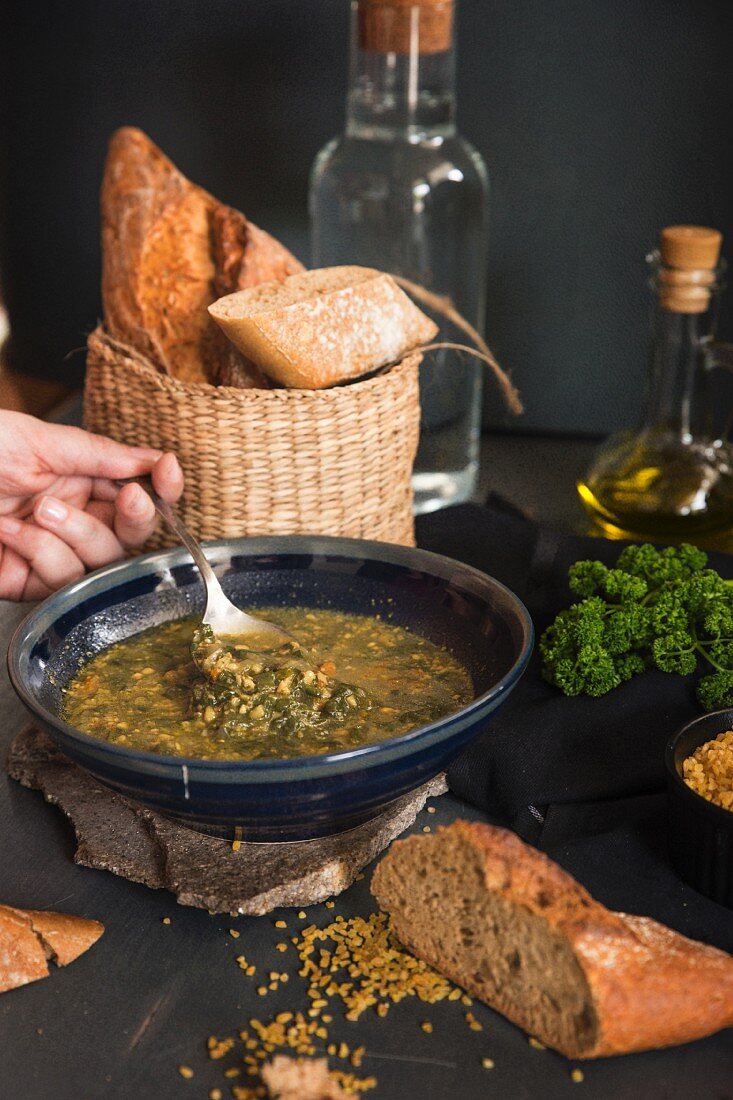 Vegetable soup with herbs and bread