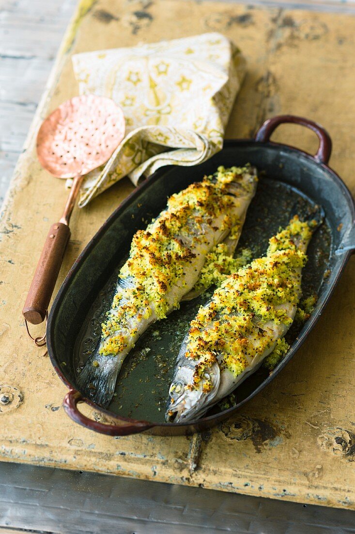 Oven-baked sea bass topped with a spicy coconut paste (India)