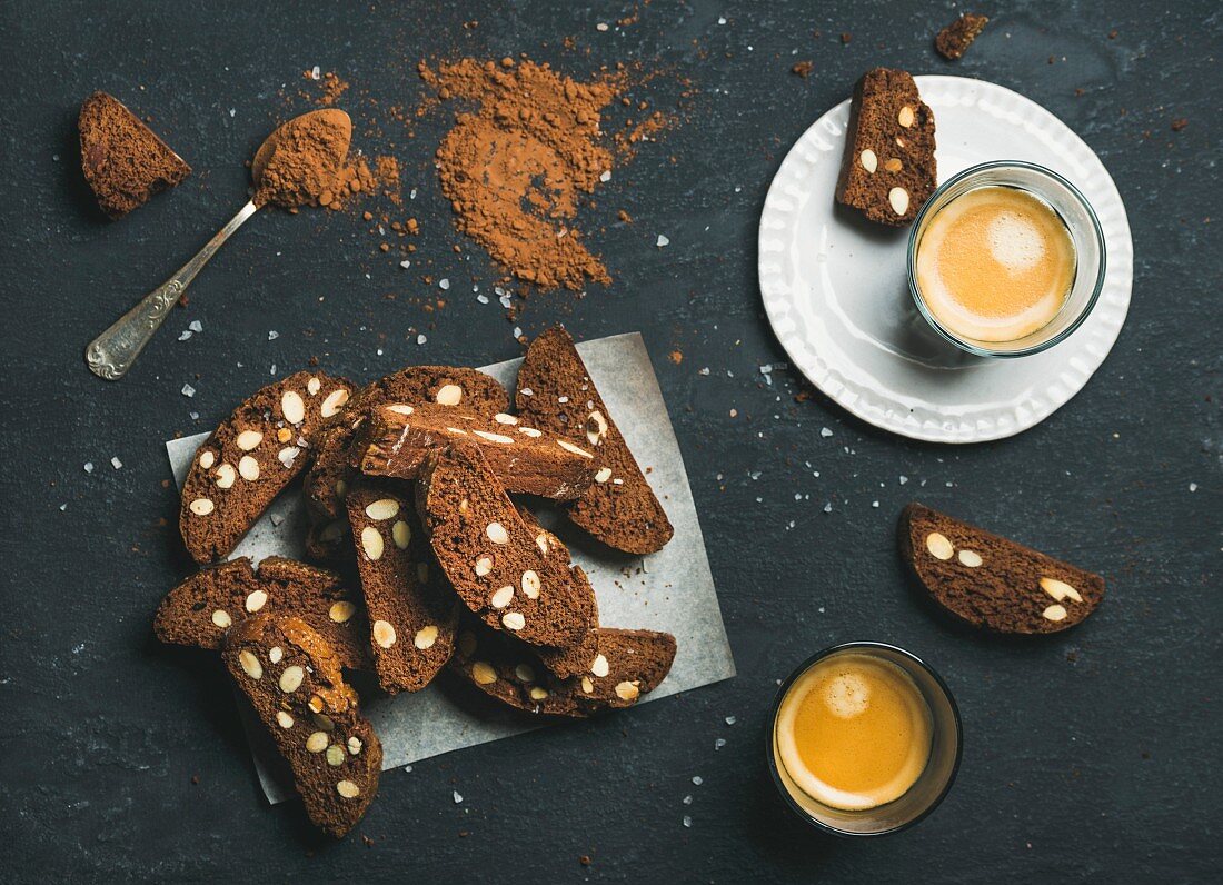 Dark chocolate and sea salt Biscotti with almonds and two glasses of coffee espresso