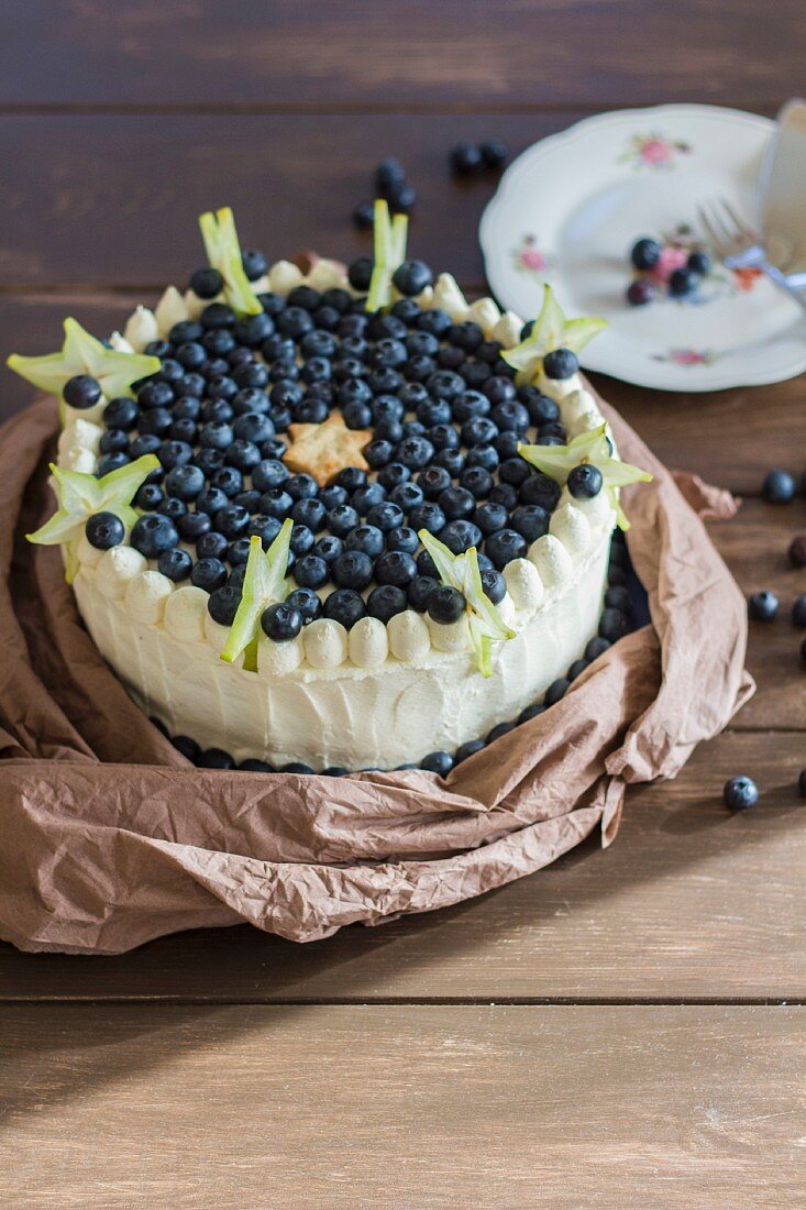 Citrus and blueberry cake decorated with star fruit slices