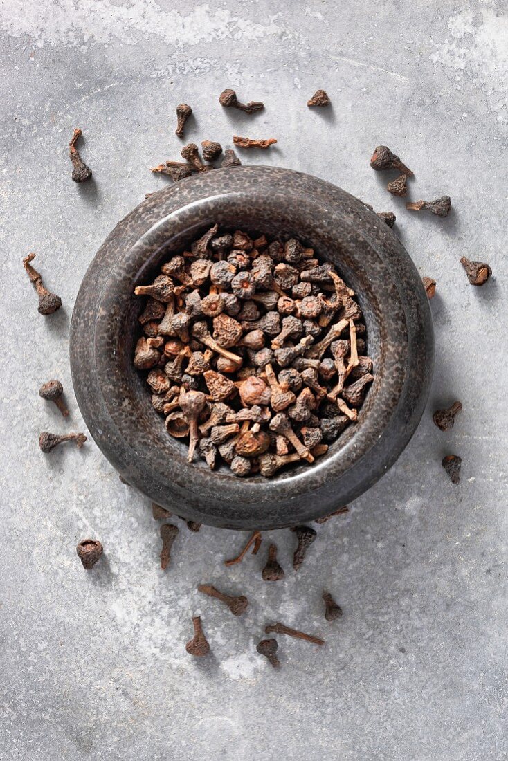 Cinnamon blossoms in a mortar