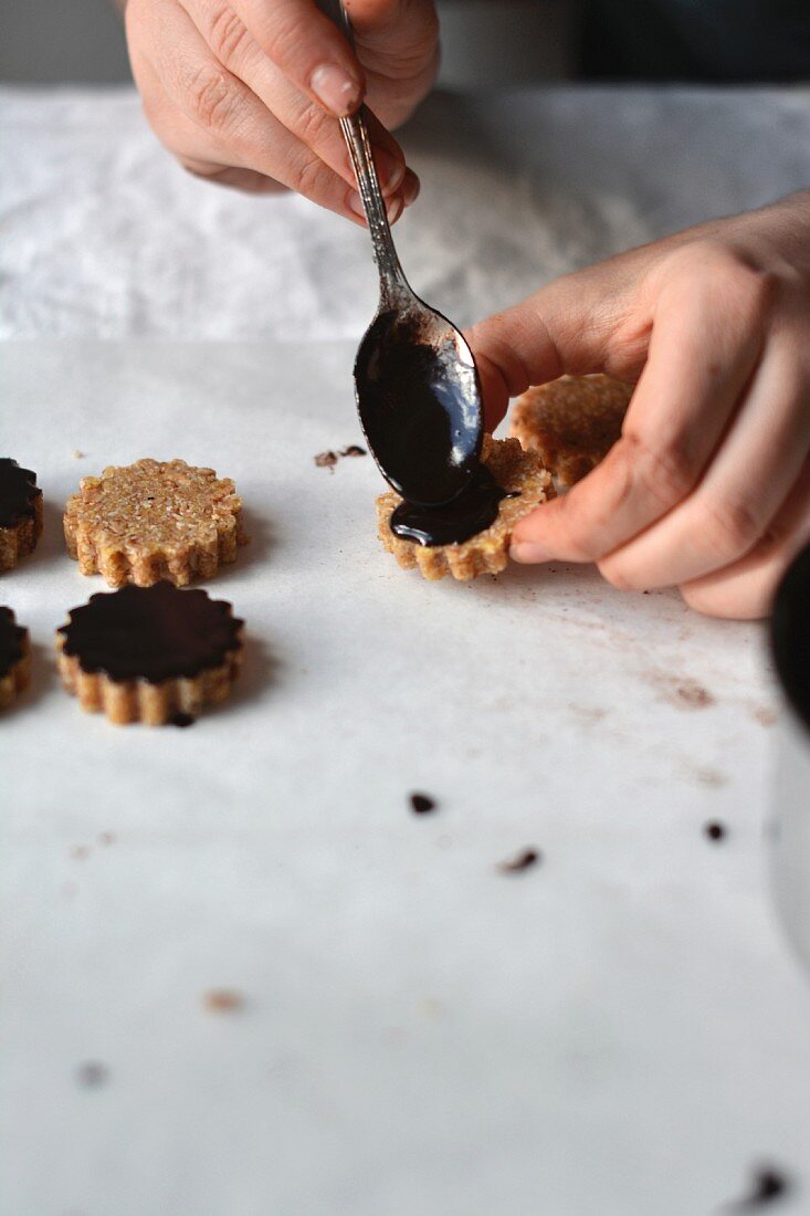 Raw vegan oat cookies with a chocolate glaze