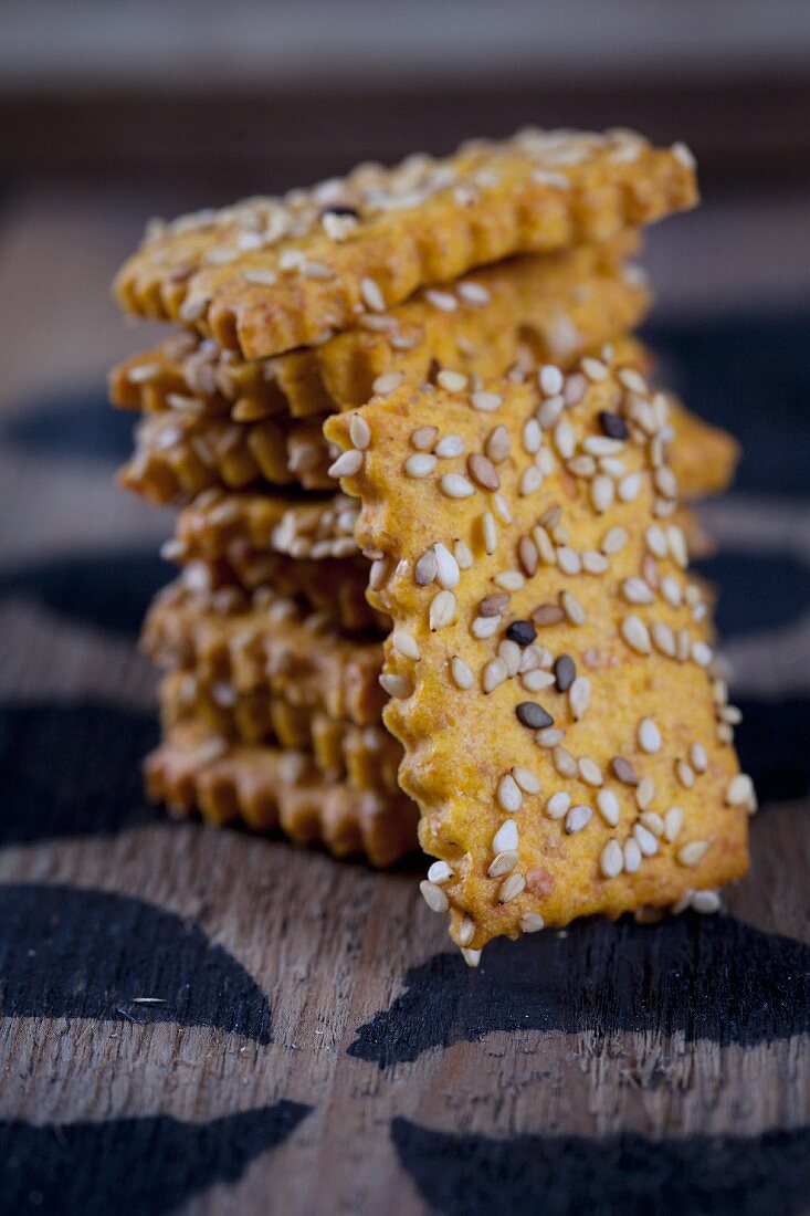 A stack of sweet potato crackers with sesame seeds