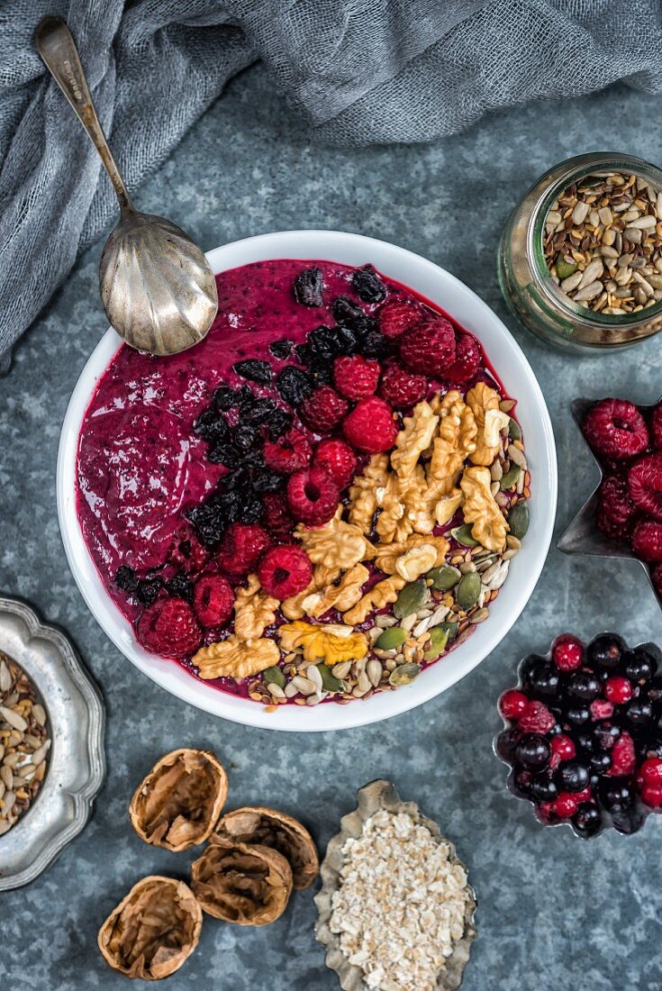 Mixed berry smoothie bowl with walnuts and seeds