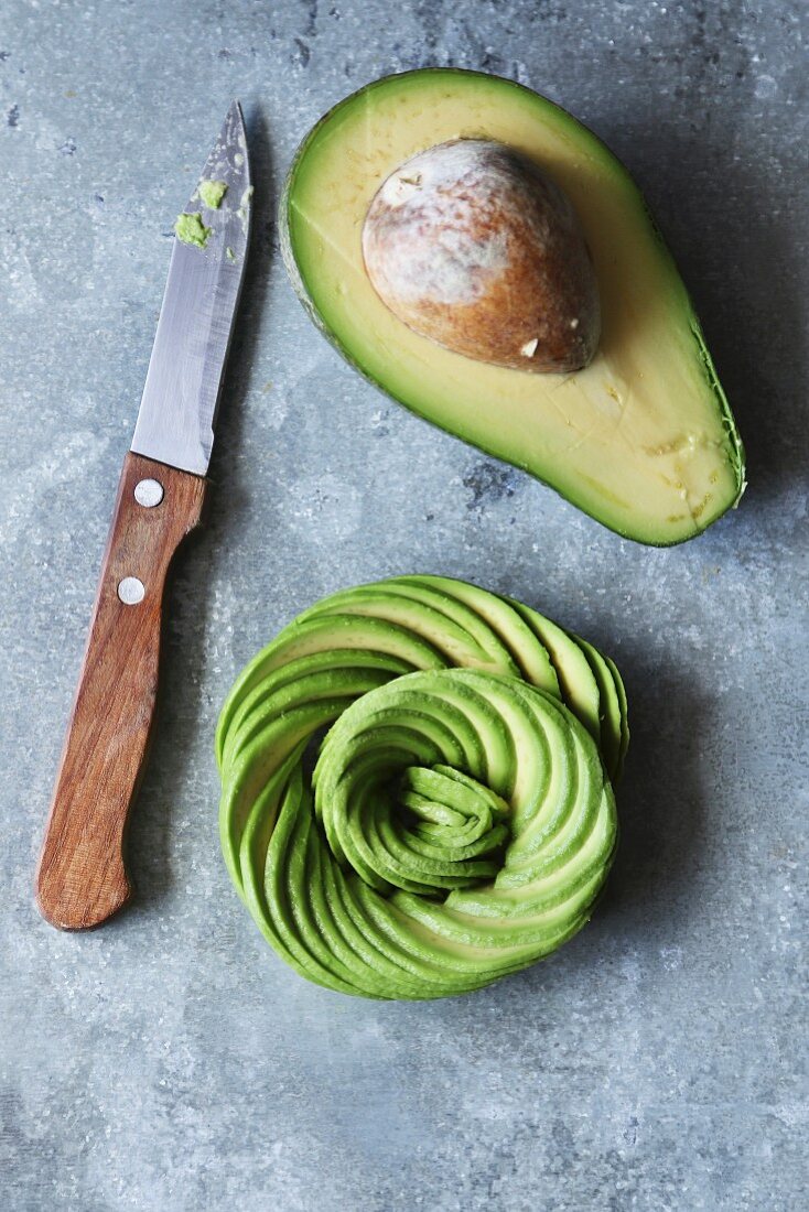 Avocado rose on a metal background, top view