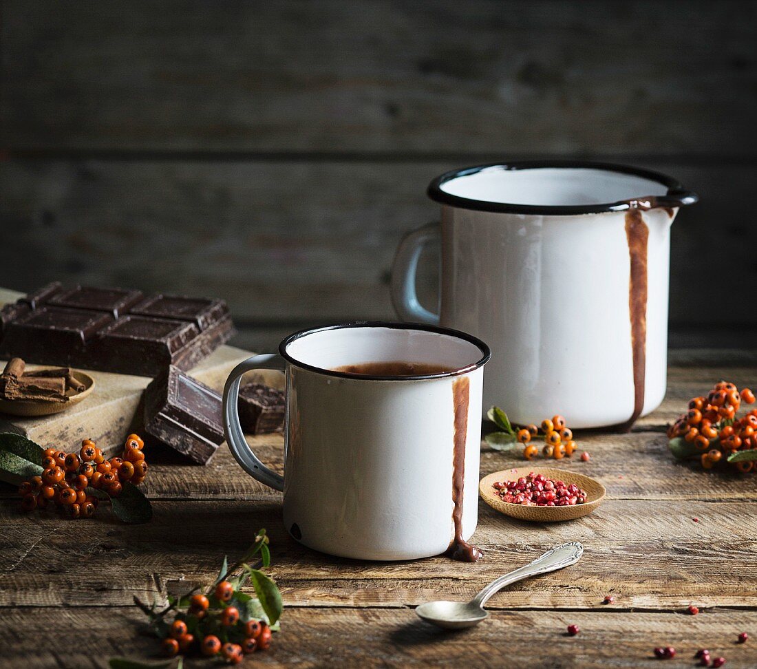 Mug with hot chocolate on wooden table