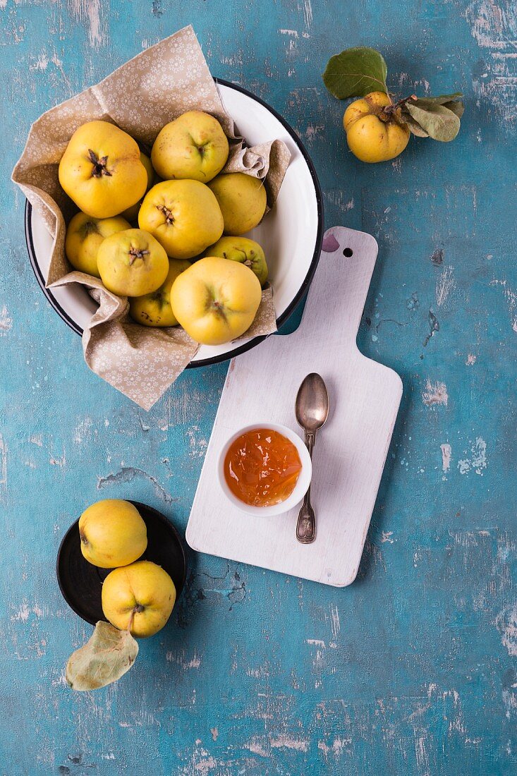 Quince in an enamel bowl with quince jelly