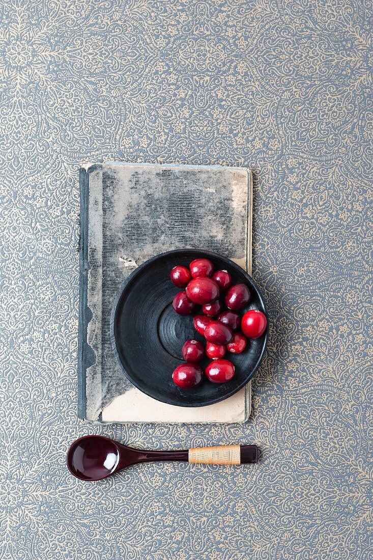 Cranberries on a black plate