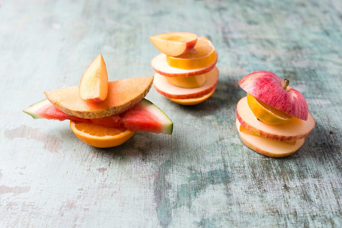 Fruit stacks with apple, watermelon, lemon, orange and banana