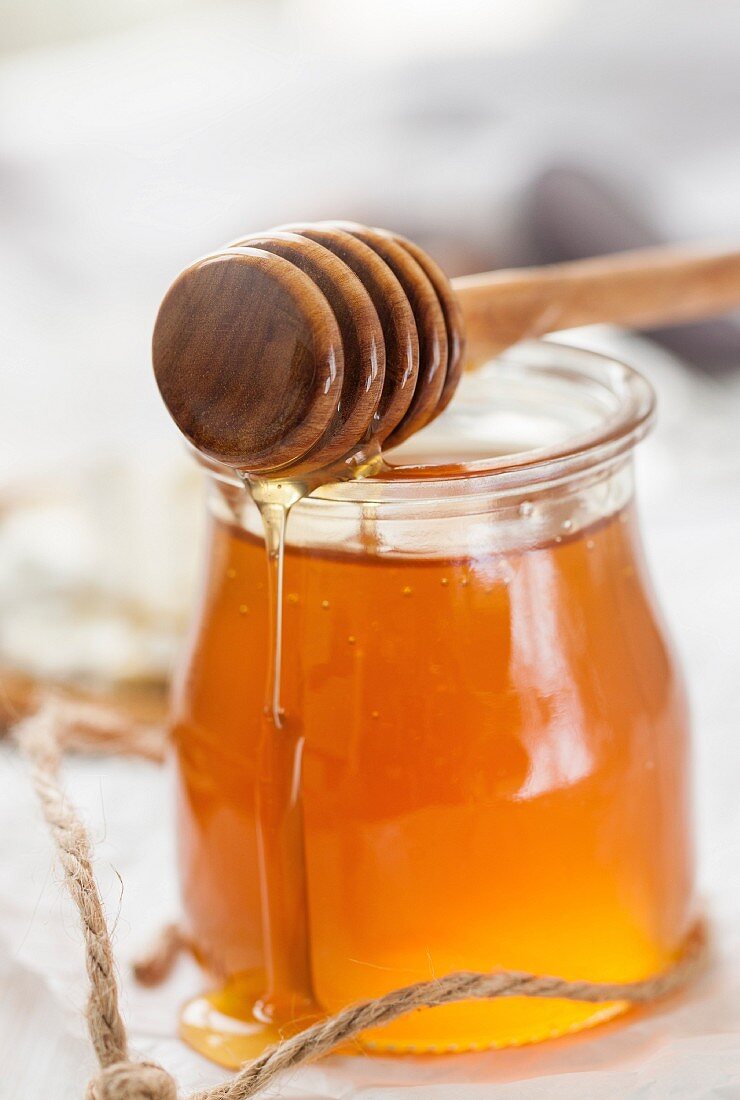 Honey with a honey dipper