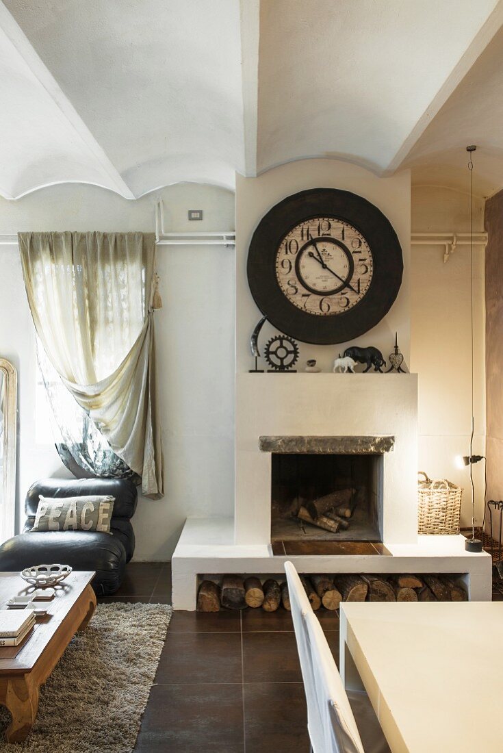 Open fireplace in living room in converted wine cellar