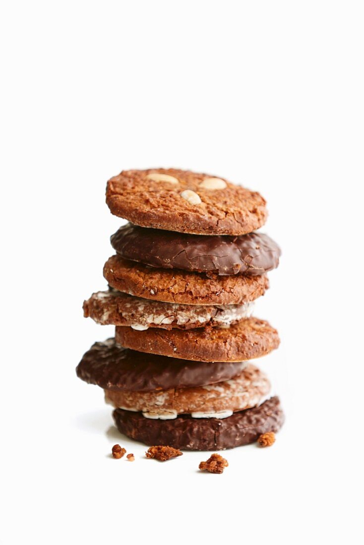 A stack of gingerbread cookies in front of a white background
