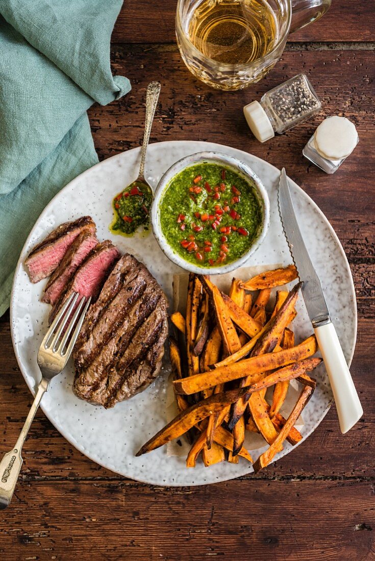 Griddled fillet steak with sweet potato fries and chimichurri sauce