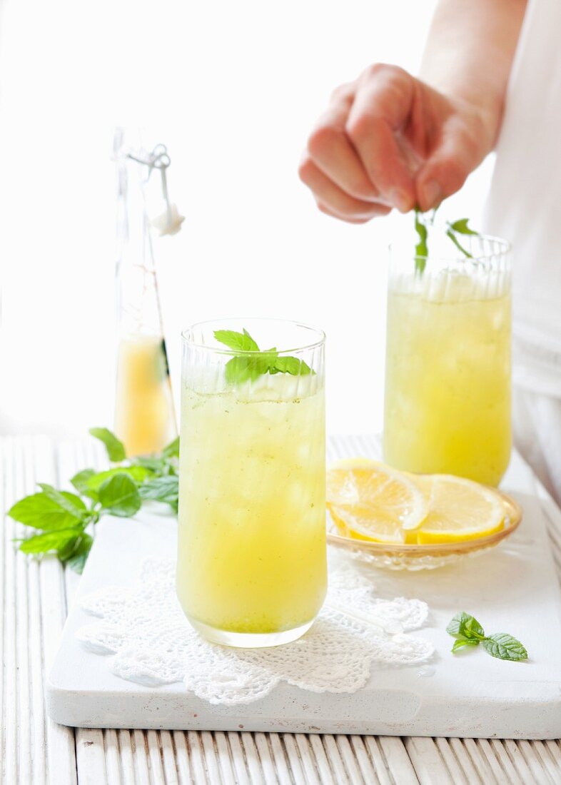 Apple and lemon lemonade with a mint decoration