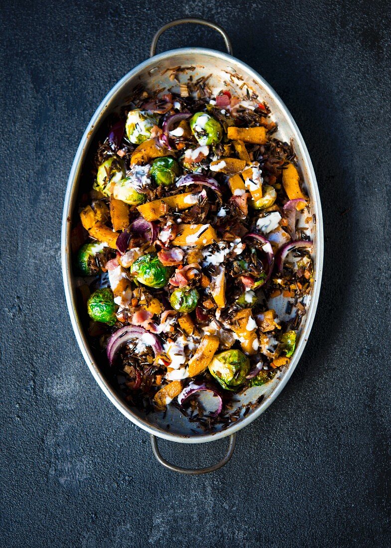 Roasted sweet pumpkins, brussels sprouts flavored with spices and tossed with wild rice topped with bacon bits and a lemon creme fraiche dressing