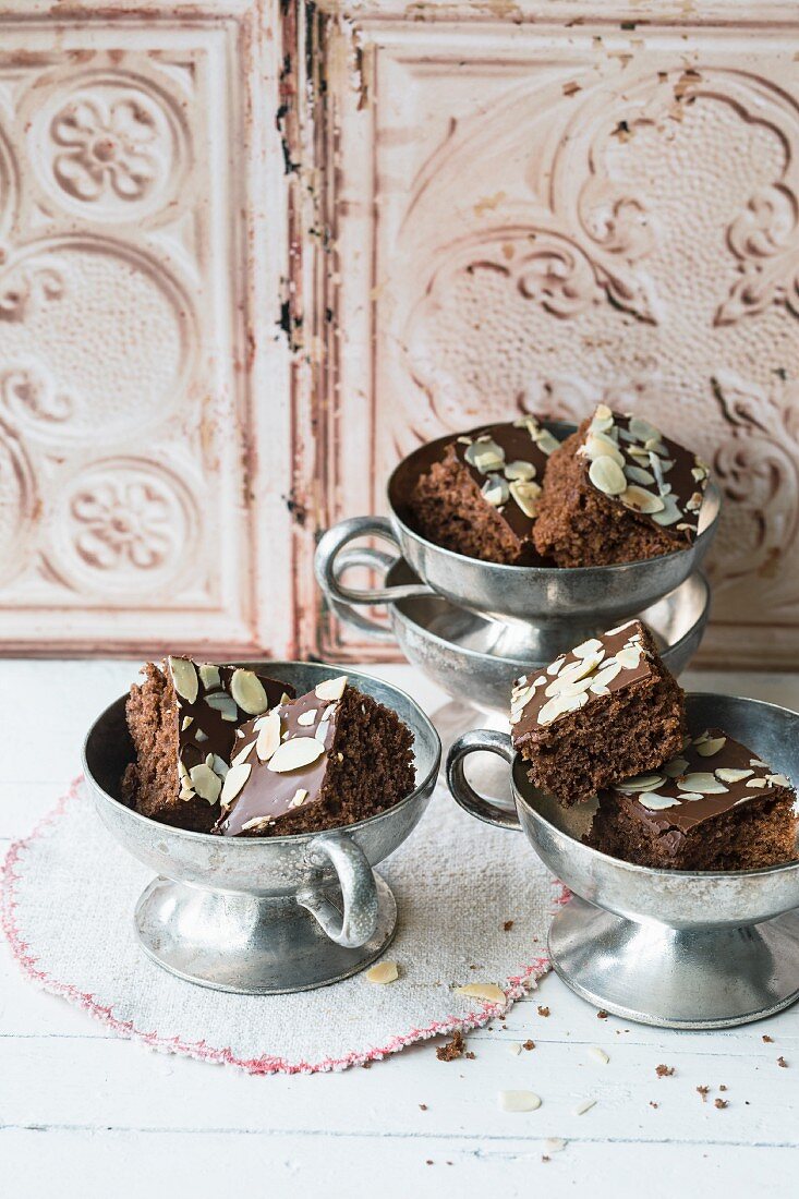 Quick and easy chocolate gingerbread cakes topped with flaked almonds