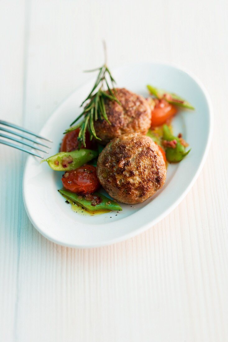 Lamb meatballs with rosemary, beans and tomatoes