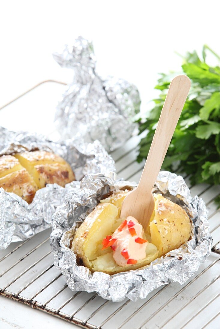 Potatoes in foil with a pepper dip