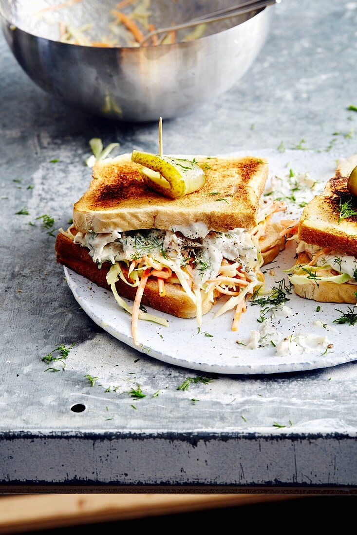 A smoked trout fillet and coleslaw sandwich (soul food)