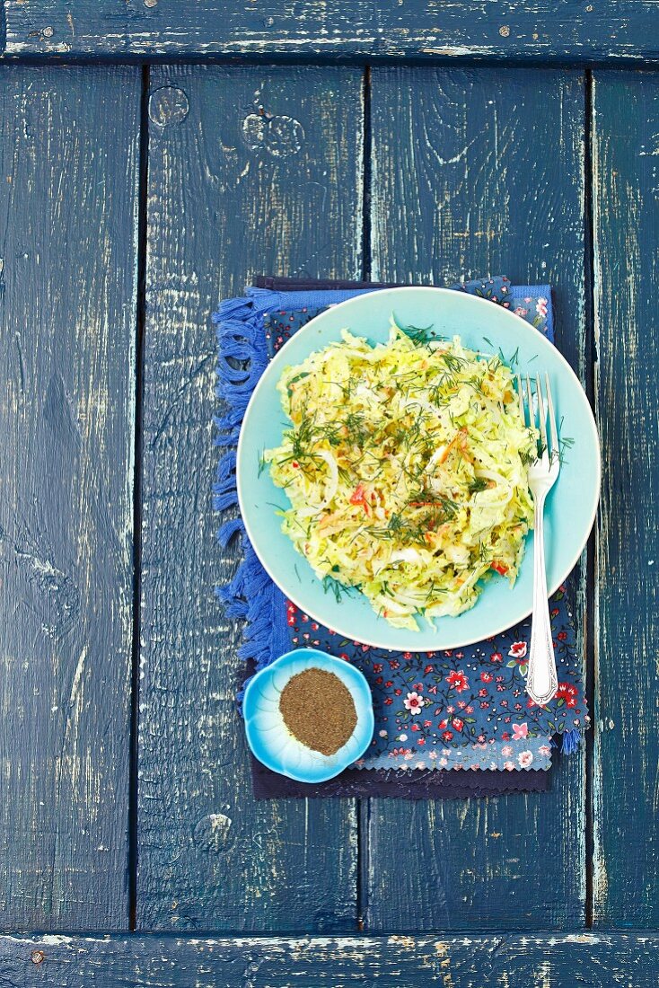 Savoy cabbage salad with apple, pickled cucumber and dill