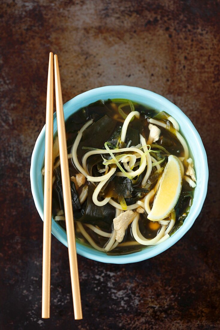 Asian-style chicken broth with wakame and lemon