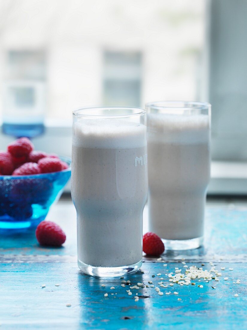 Vegan hemp and cashew shake with fresh raspberries