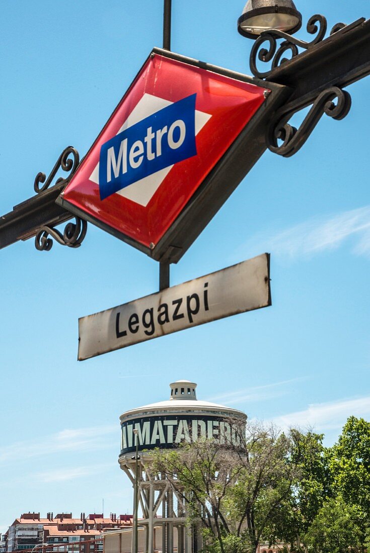 The water tower and Metro sign in front of the Matadero cultural centre in Madrid, Spain