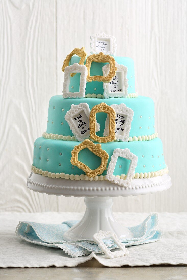 Three-tier 'Photo Frame' buttercream cake with fondant icing