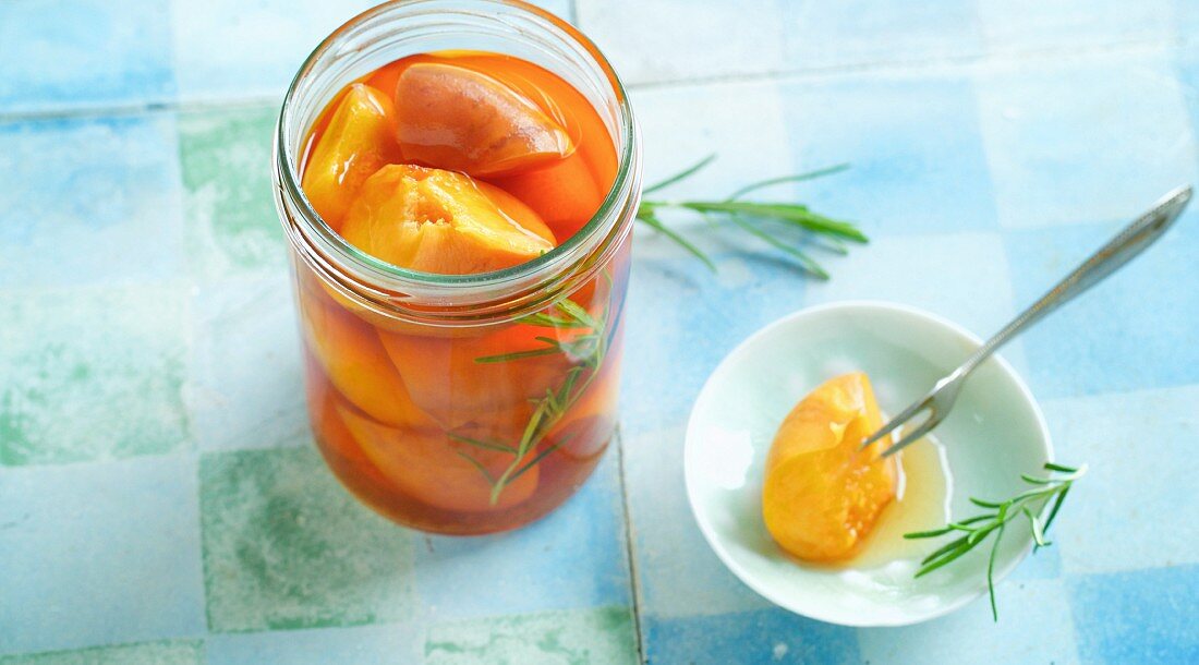 Preserved baked peaches with rosemary