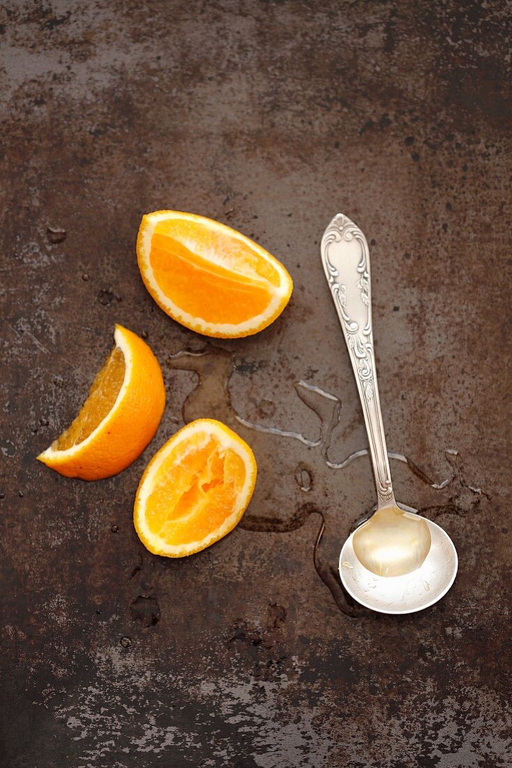 Orange and orange syrup on spoon