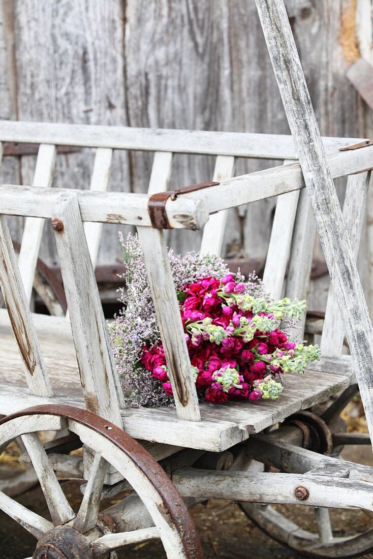 Bouquet of stocks and sea lavender in pull-along cart