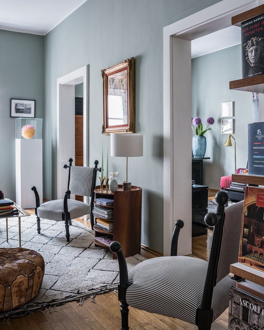 Two doorways leading from living room into adjoining room