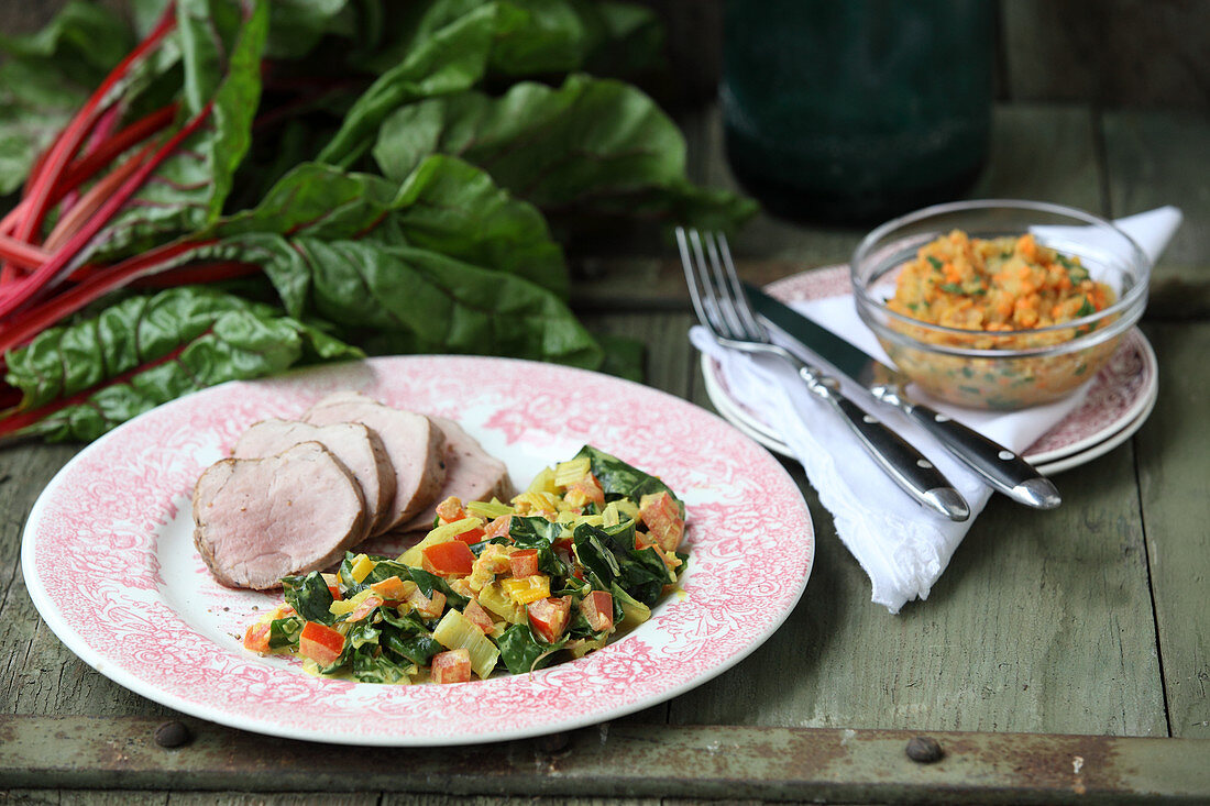 Pork fillet with curried chard and red lentils