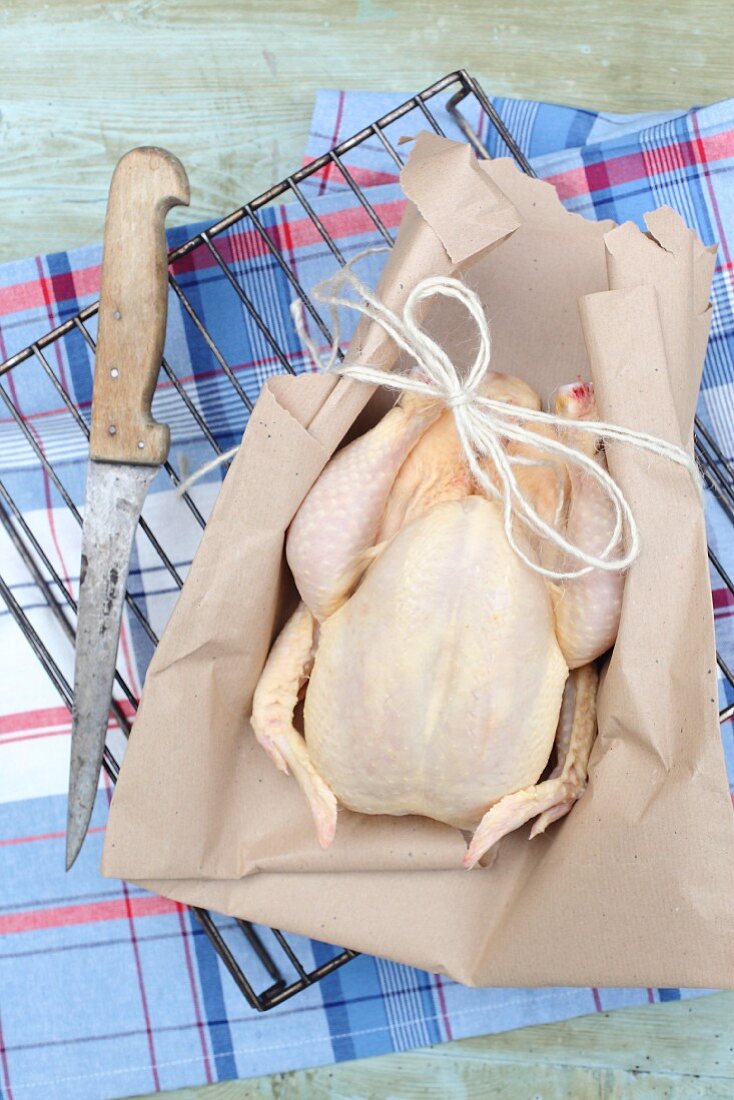 Free range chicken wrapped in parchment paper