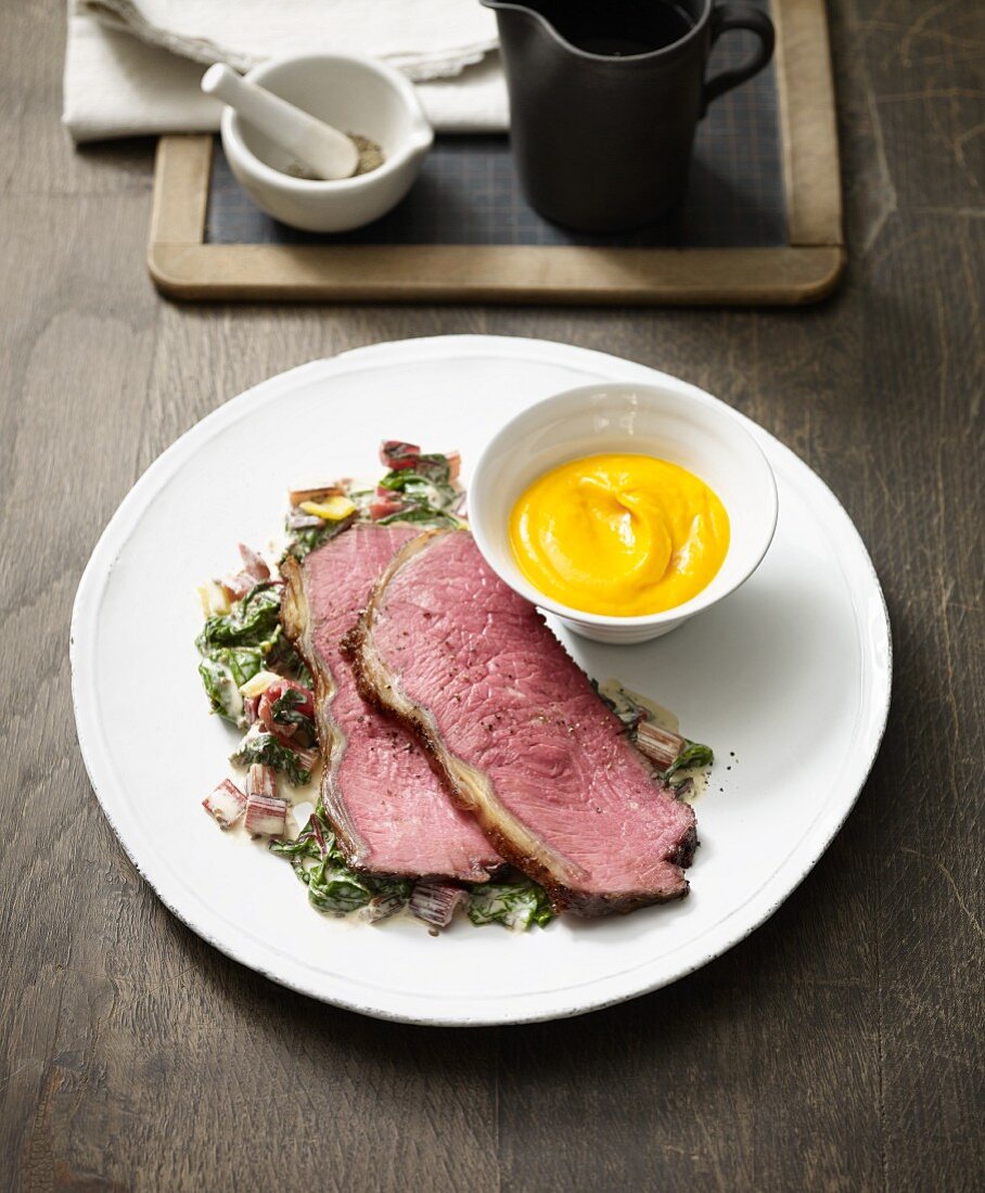 Roast beef with chard sauce and pumpkin mash