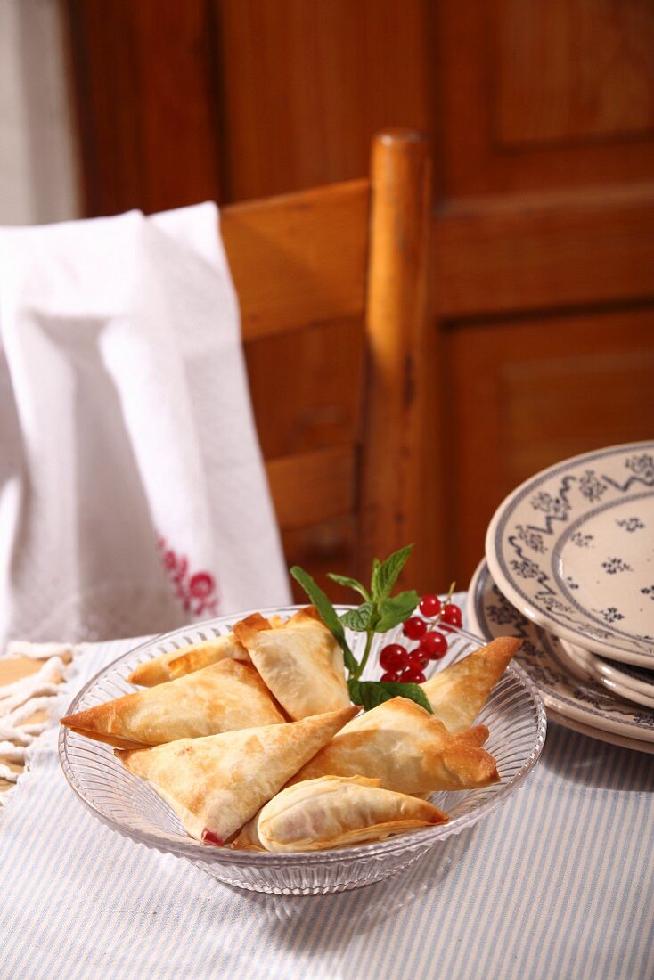 Strudel pastries filled with sheep's cheese, currants and mint