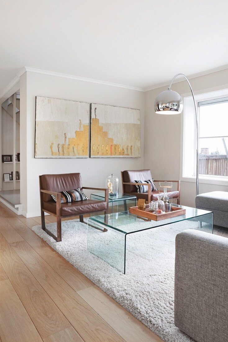 Arc lamp and glass table in elegant lounge area