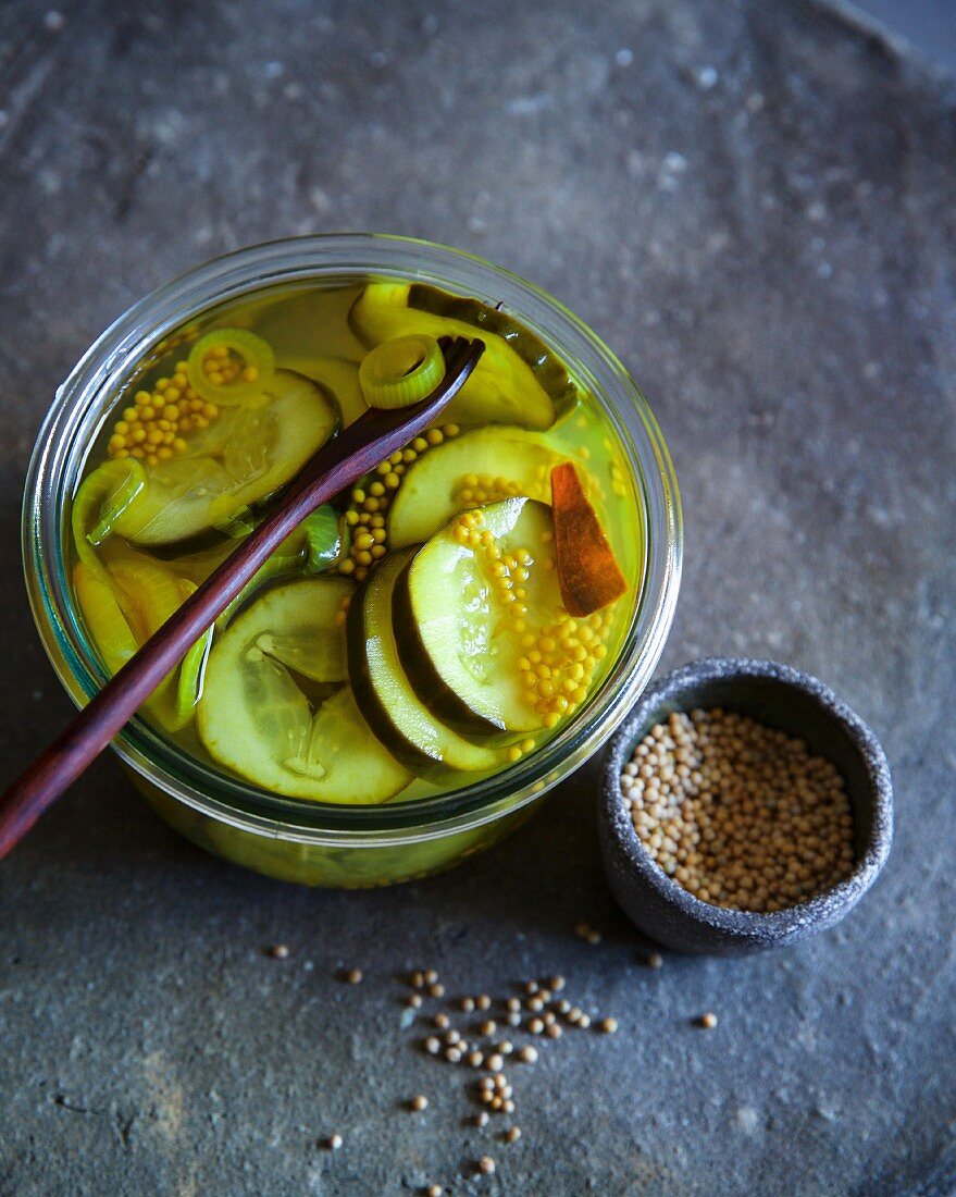 Sweet and sour cucumber slices pickled in white wine vinegar with mustard seeds