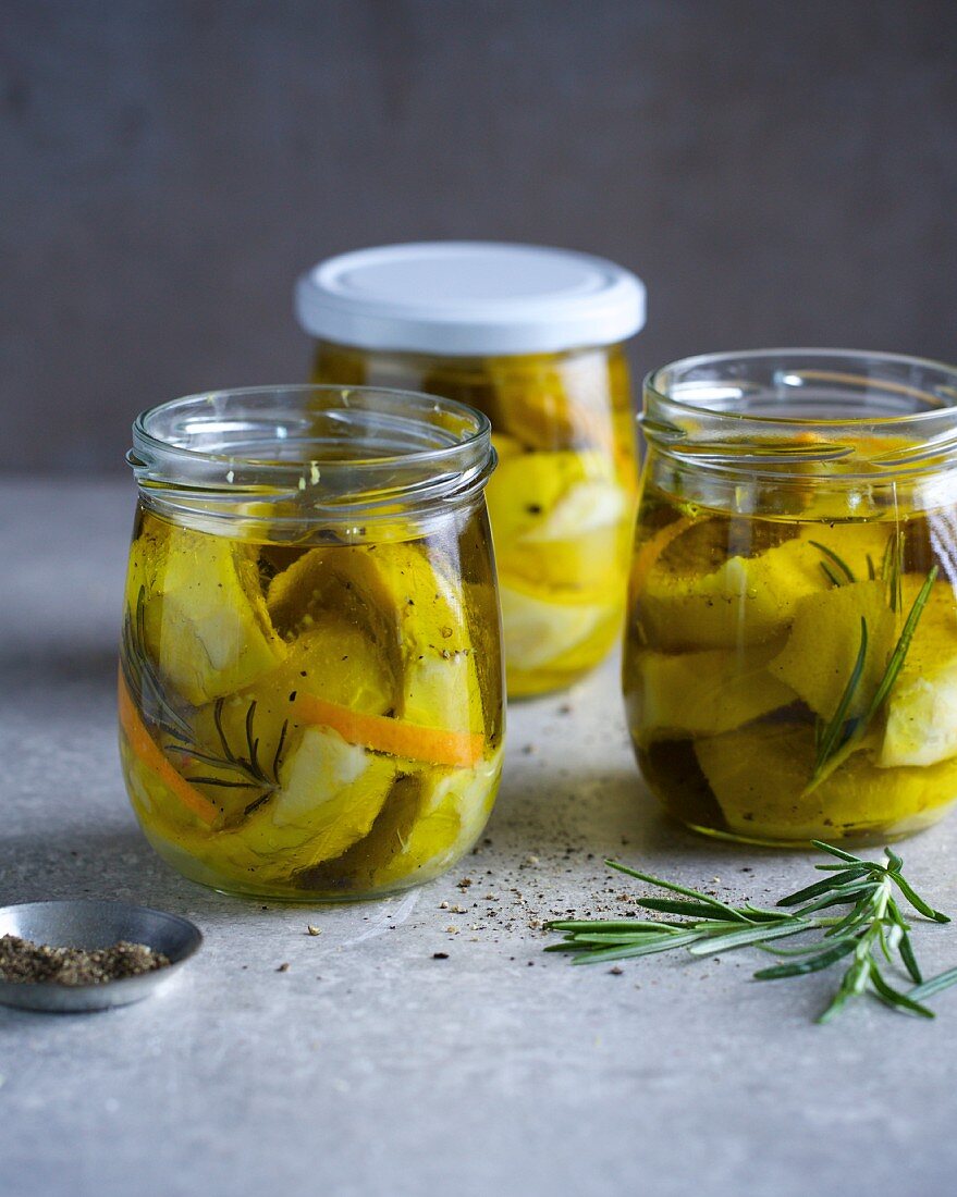 Artichokes marinated in olive oil with orange and rosemary