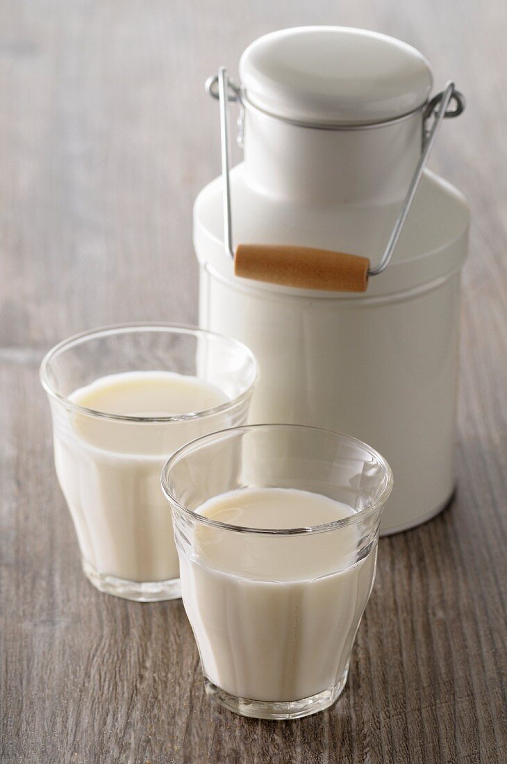 A milk jug and two glasses of milk