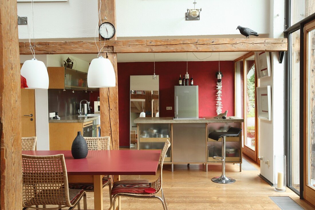 Rustic beams in open-plan kitchen