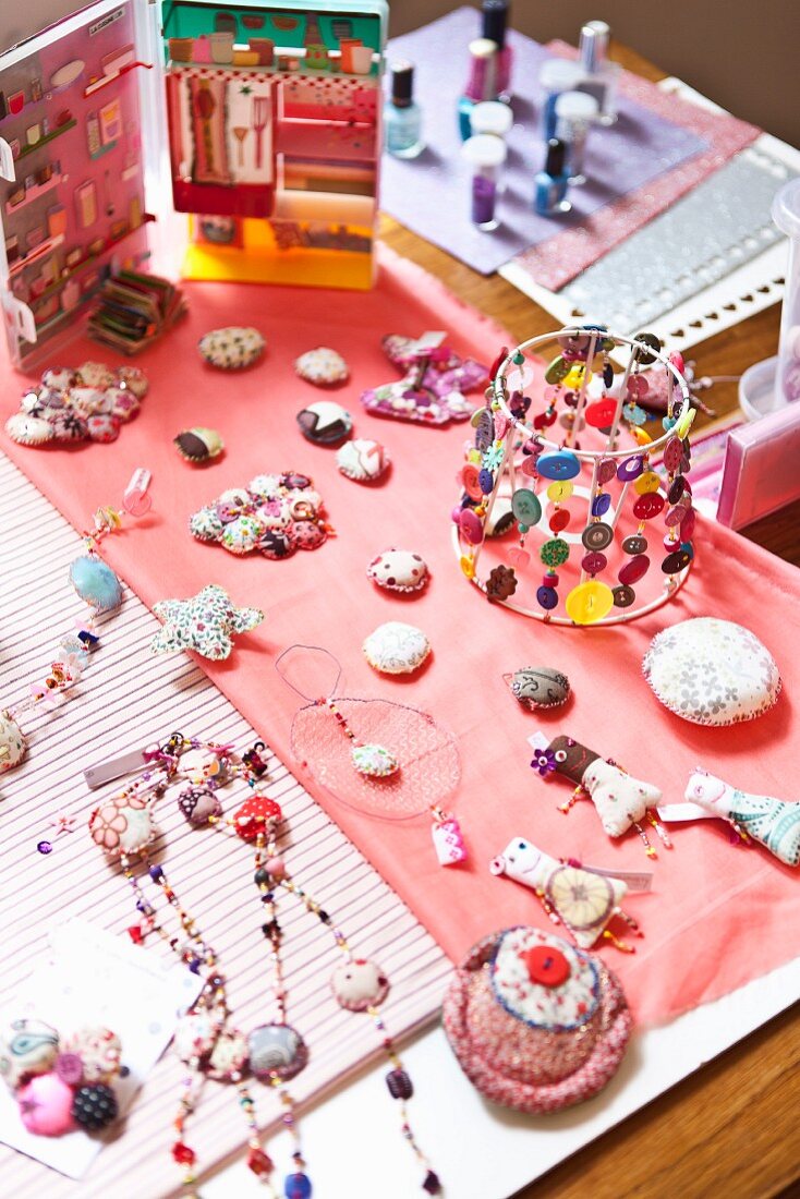 Various accessories made from colourful fabrics and buttons