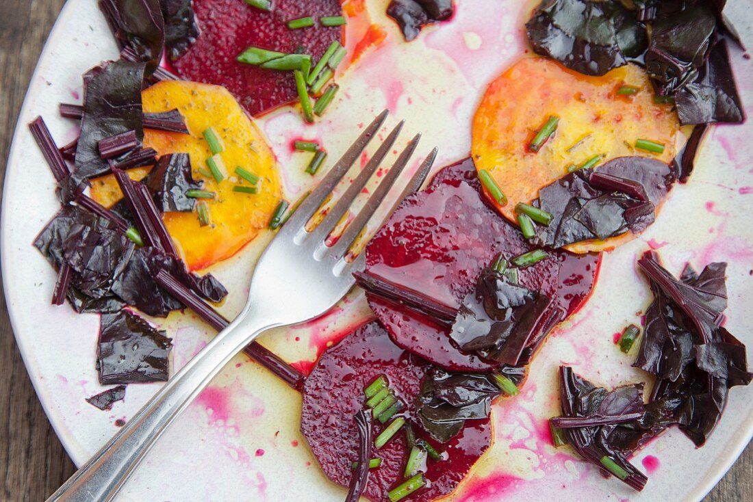 Beetroot carpaccio with beetroot leaves and chives