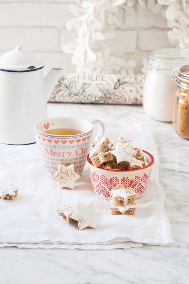 Cinnamon stars served with a cup of tea