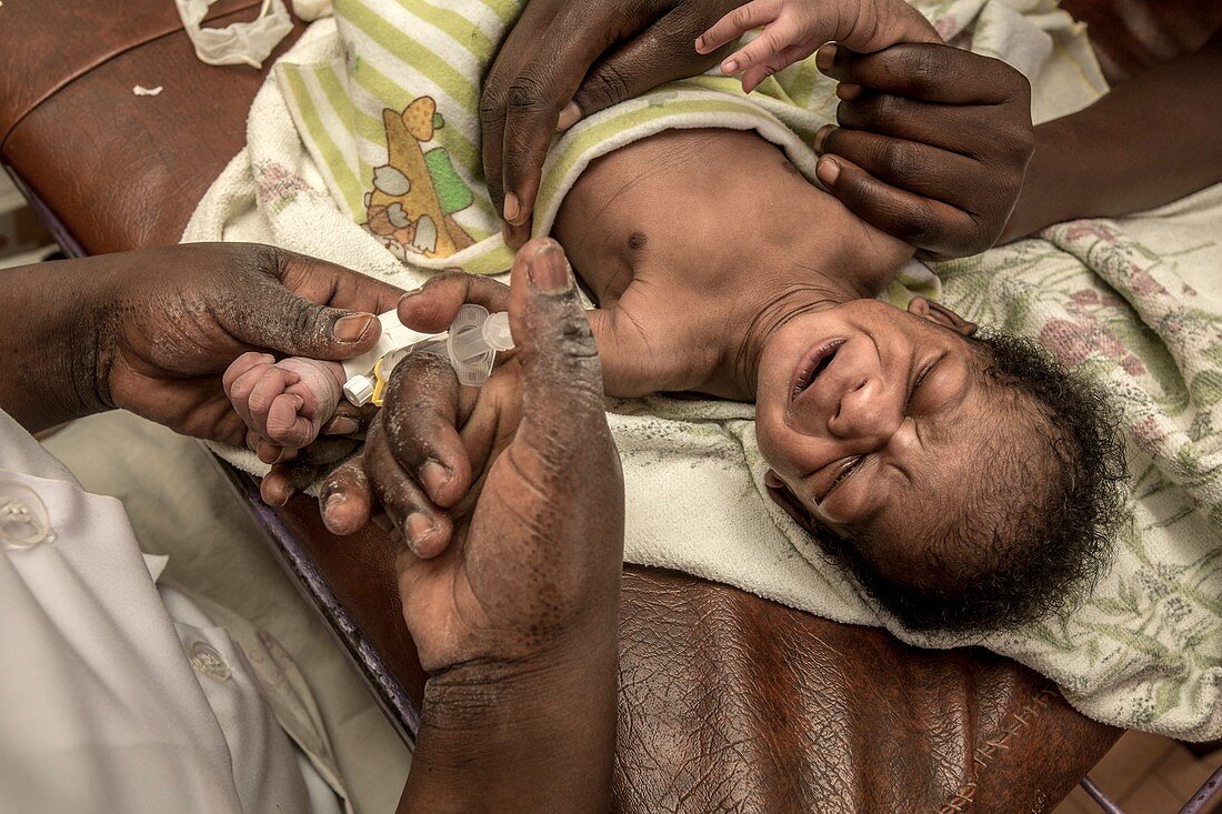 Doctor caring for a baby in hospital