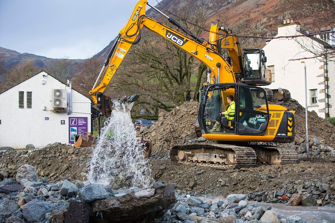 Diggers removing flood debris, UK