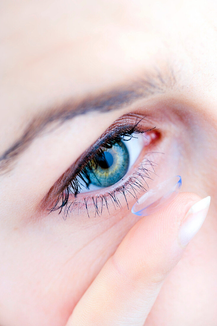 Woman using contact lenses